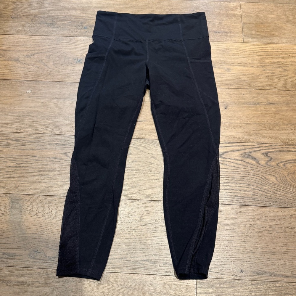 Athleta 7/8 black leggings with mesh design size M